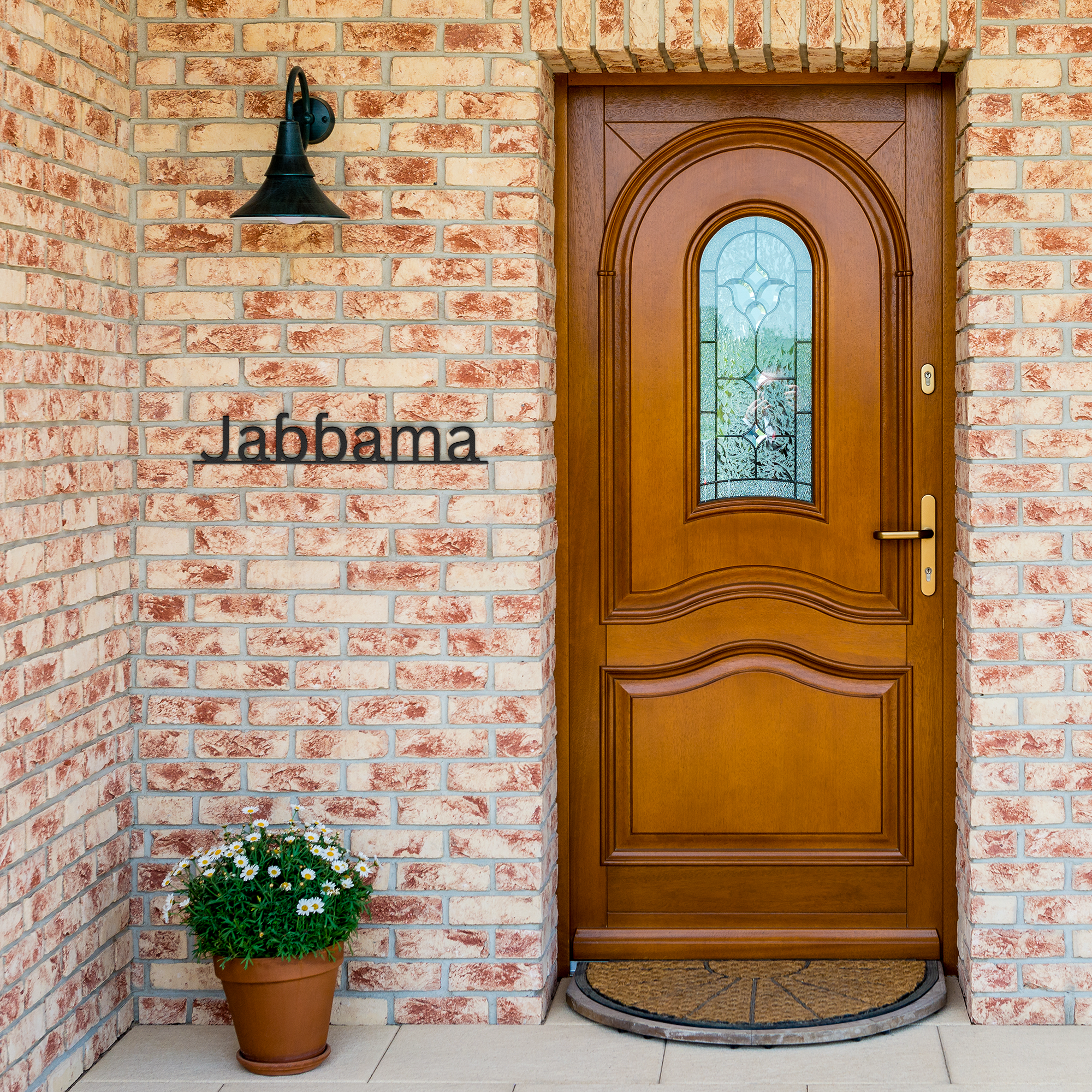 Fulani_Welcome_Metal_Sign_Fulani_We_Black_Brick_Entrance_Mockup.png_6047572